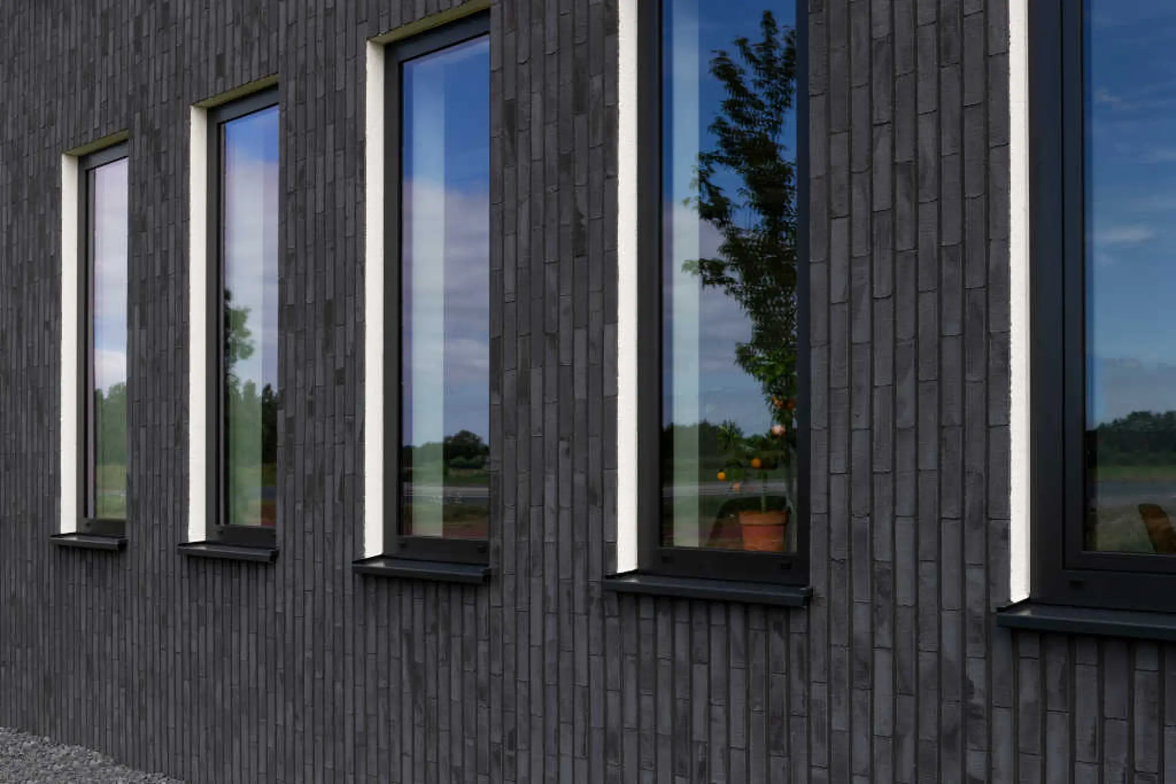 Biurowiec z elewacją z elastycznych płytek StoCleyer B o wyglądzie cegły