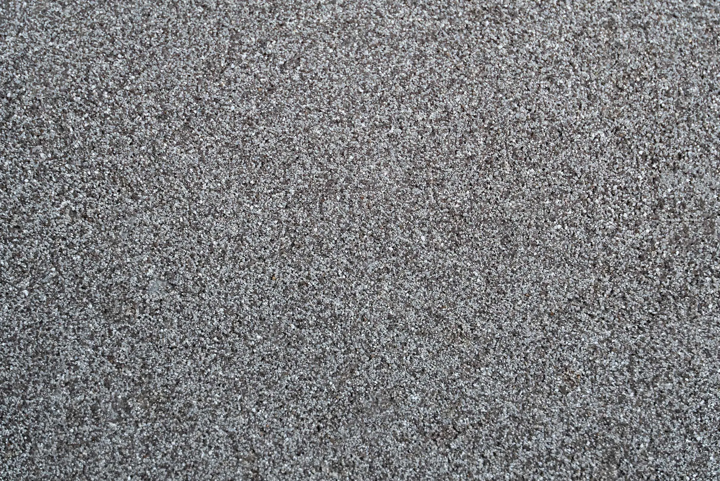 Powierzchnia tynku, tynk wielobarwny StoSuperlit® K 0,8 w kolorze szarym